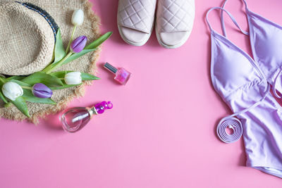 High angle view of personal accessories on yellow background