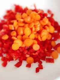 Close-up of chopped berries over white background