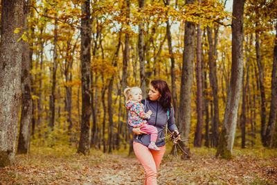 Woman standing in forest