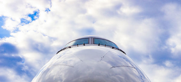 Low angle view of airplane against sky