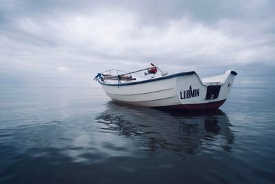 Boat in sea against sky