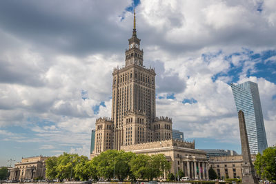 Low angle view of building against cloudy sky