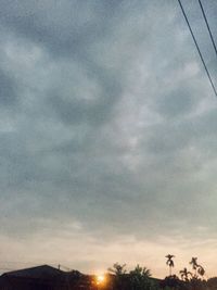 Low angle view of cloudy sky at sunset