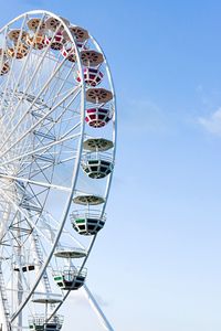 Low angle view of ferris wheel against sky