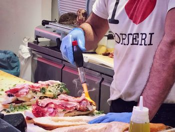 Midsection of man preparing food