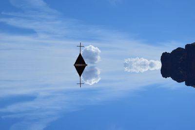 Church steeple against blue sky