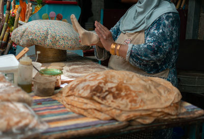 Midsection of woman preparing food