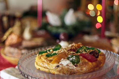 Portuguese traditional christmas cake called bolo rei or king's cake on christmas table