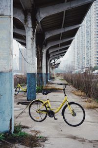 Bicycle parked by building at station