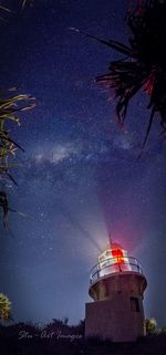 Low angle view of illuminated tree at night