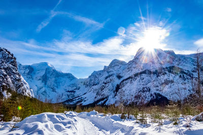 Scenic view of snowcapped mountains against sky