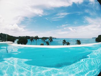 Scenic view of infinity pool against sky