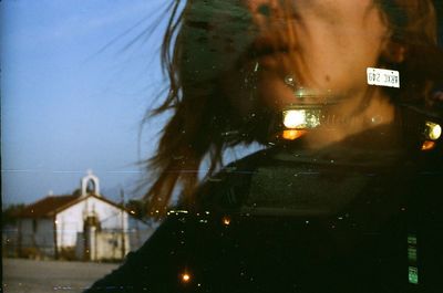 Double exposure of woman with illuminated train