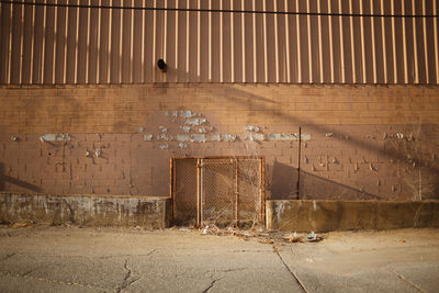 Abandoned building against wall