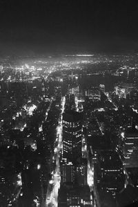 High angle view of illuminated buildings in city at night
