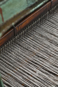 High angle view of wooden posts on beach