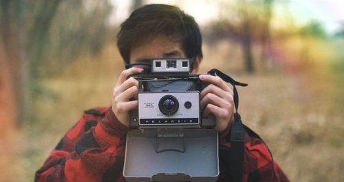Portrait of boy photographing