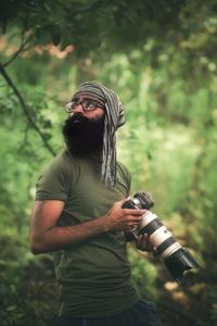 Midsection of man holding plant