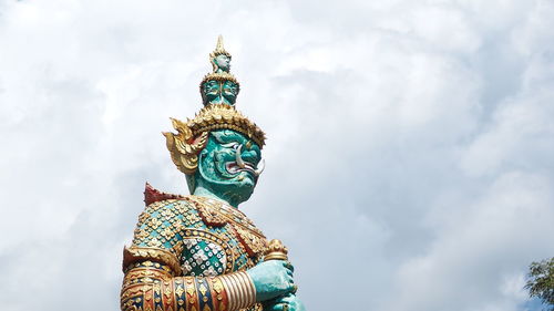 Low angle view of statue against sky