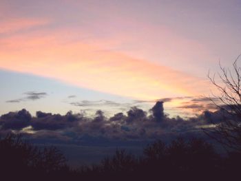 Scenic view of silhouette landscape against sky at sunset