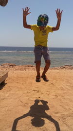 Woman jumping on beach