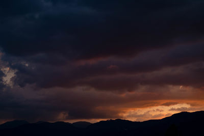 Scenic view of dramatic sky during sunset