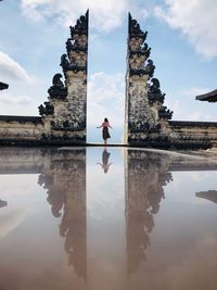 Reflection of man in lake