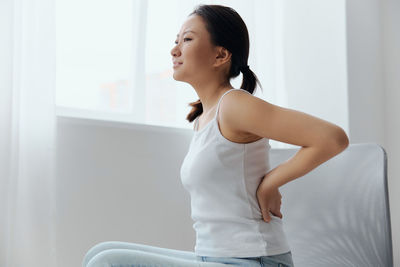 Young woman exercising at home