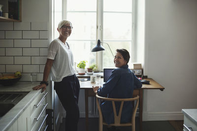 Portrait of happy industrial designers at home office