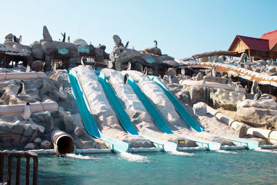 Panoramic shot of sculpture by sea against clear sky