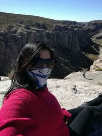 Portrait of woman on rock