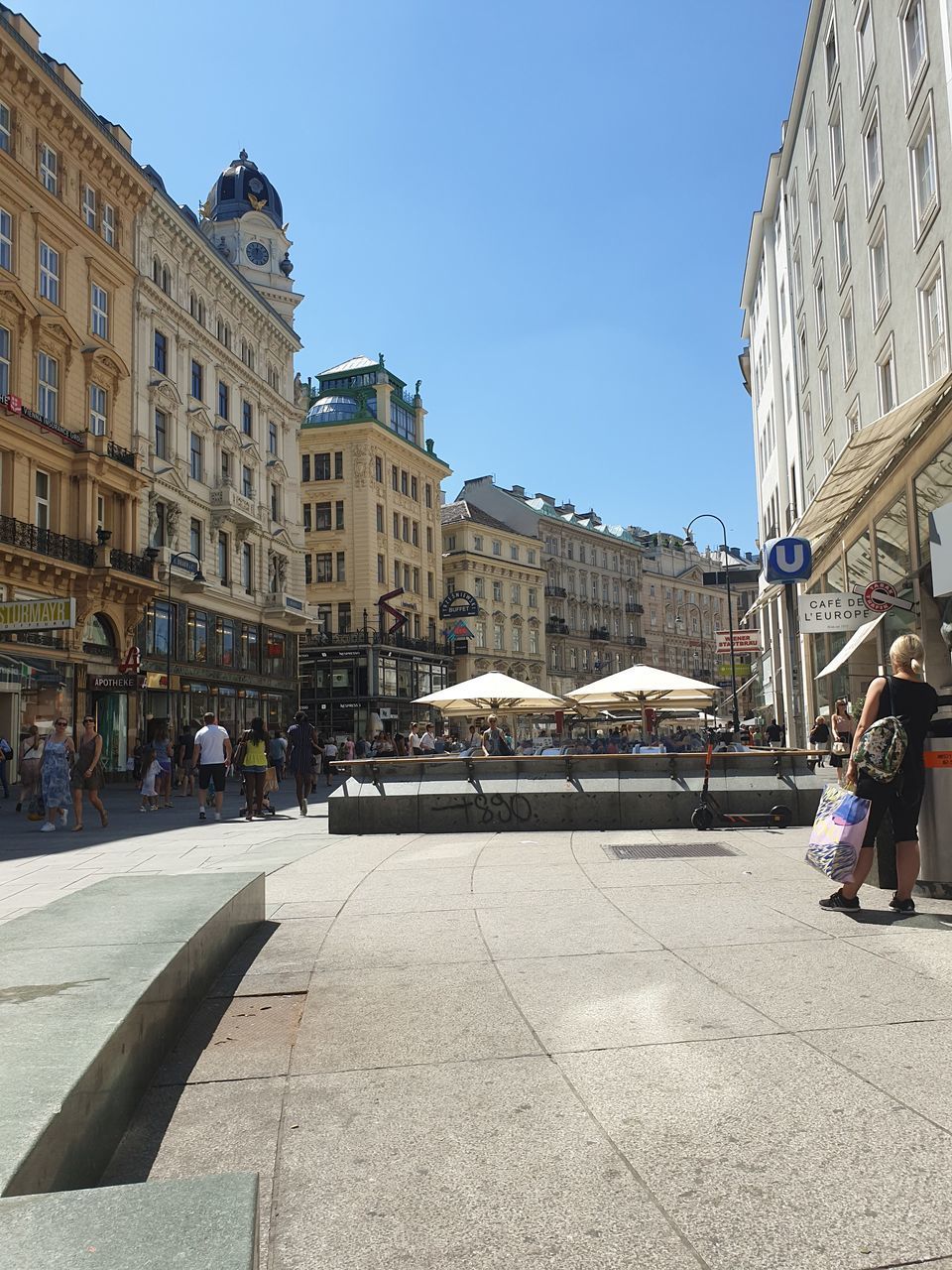 PEOPLE ON STREET IN FRONT OF BUILDINGS