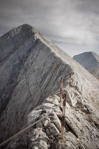 Rocky mountain against sky on sunny day