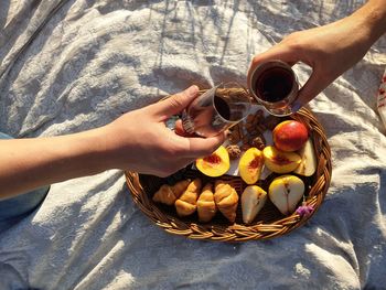 High angle view of hand holding ice cream basket