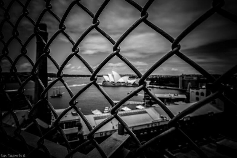 FULL FRAME SHOT OF CHAINLINK FENCE IN THE SEA