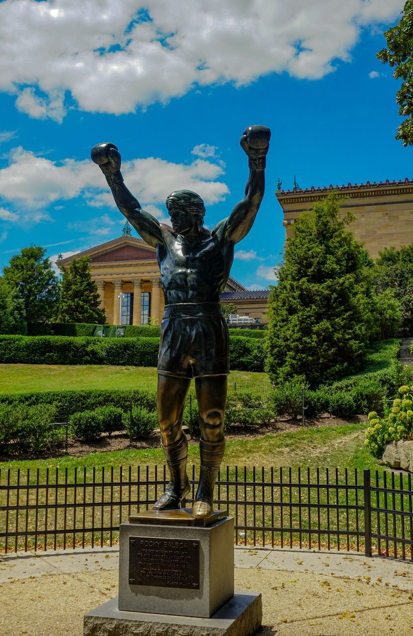 STATUE OF WOMAN AGAINST SKY