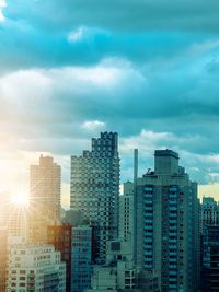 Modern buildings in city against sky