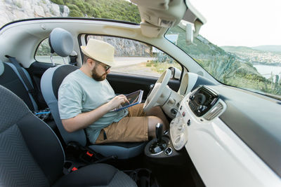 Low section of woman in car