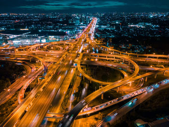 High angle view of light trails on city street at night