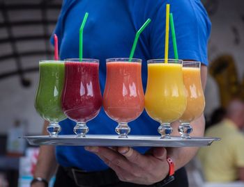 Close-up of hand holding drink