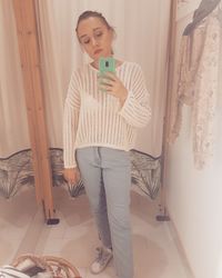 Young woman looking at home