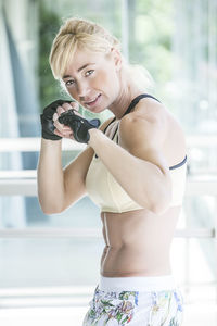 Portrait of muscular woman in fighting stance
