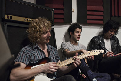 Group of people playing guitar