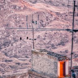 Low angle view of old building against mountains