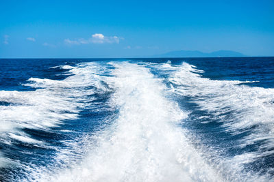 Scenic view of sea against blue sky