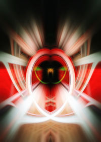 Digital composite image of light painting against black background