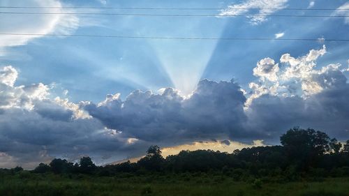 Scenic view of landscape against cloudy sky