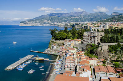 High angle view of city by sea