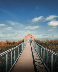 Footbridge against sky