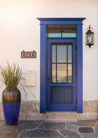 Decorative urn against house